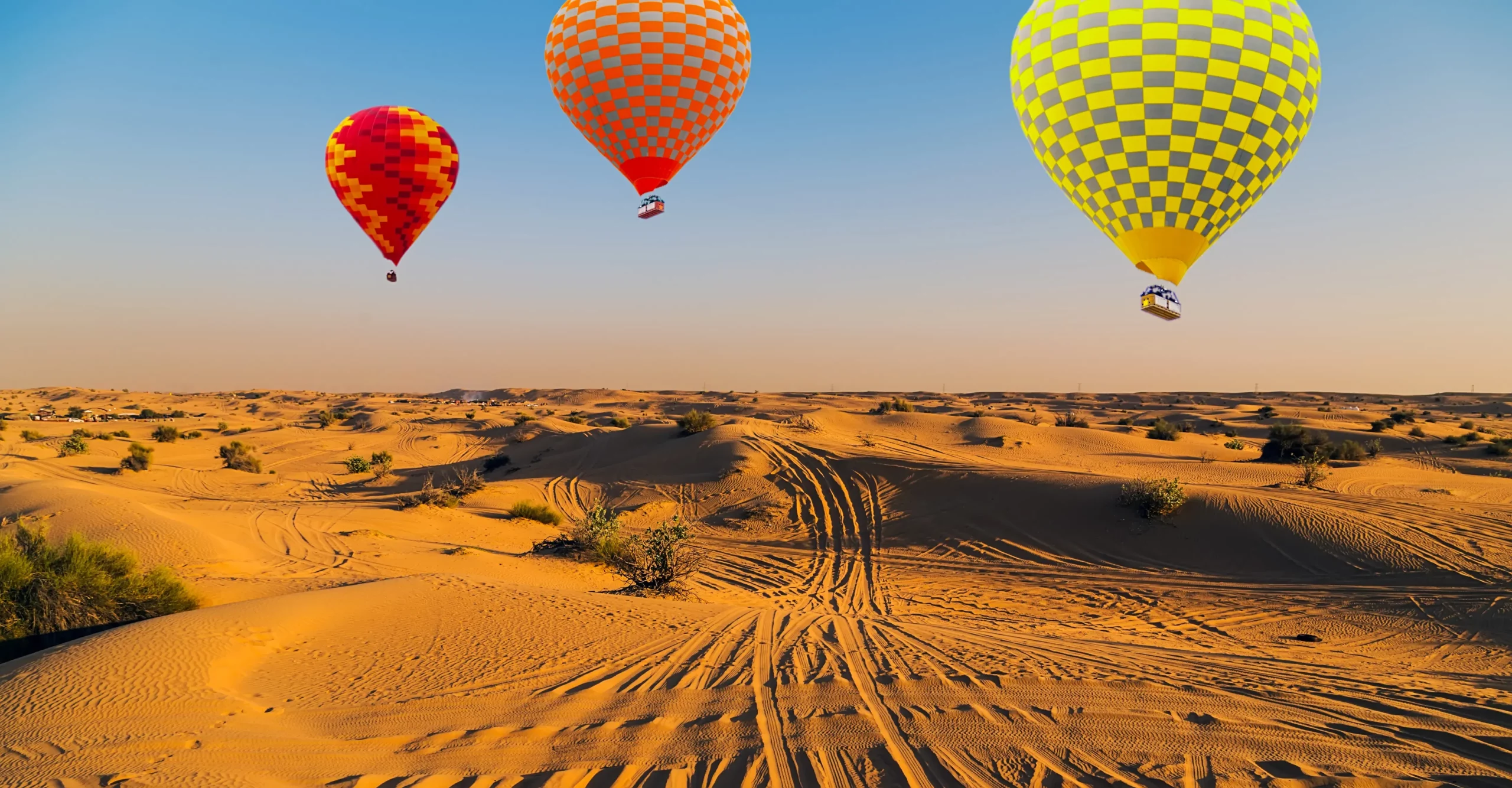 hot air balloons over the dubai desert - best places to hot air ballooning in the world