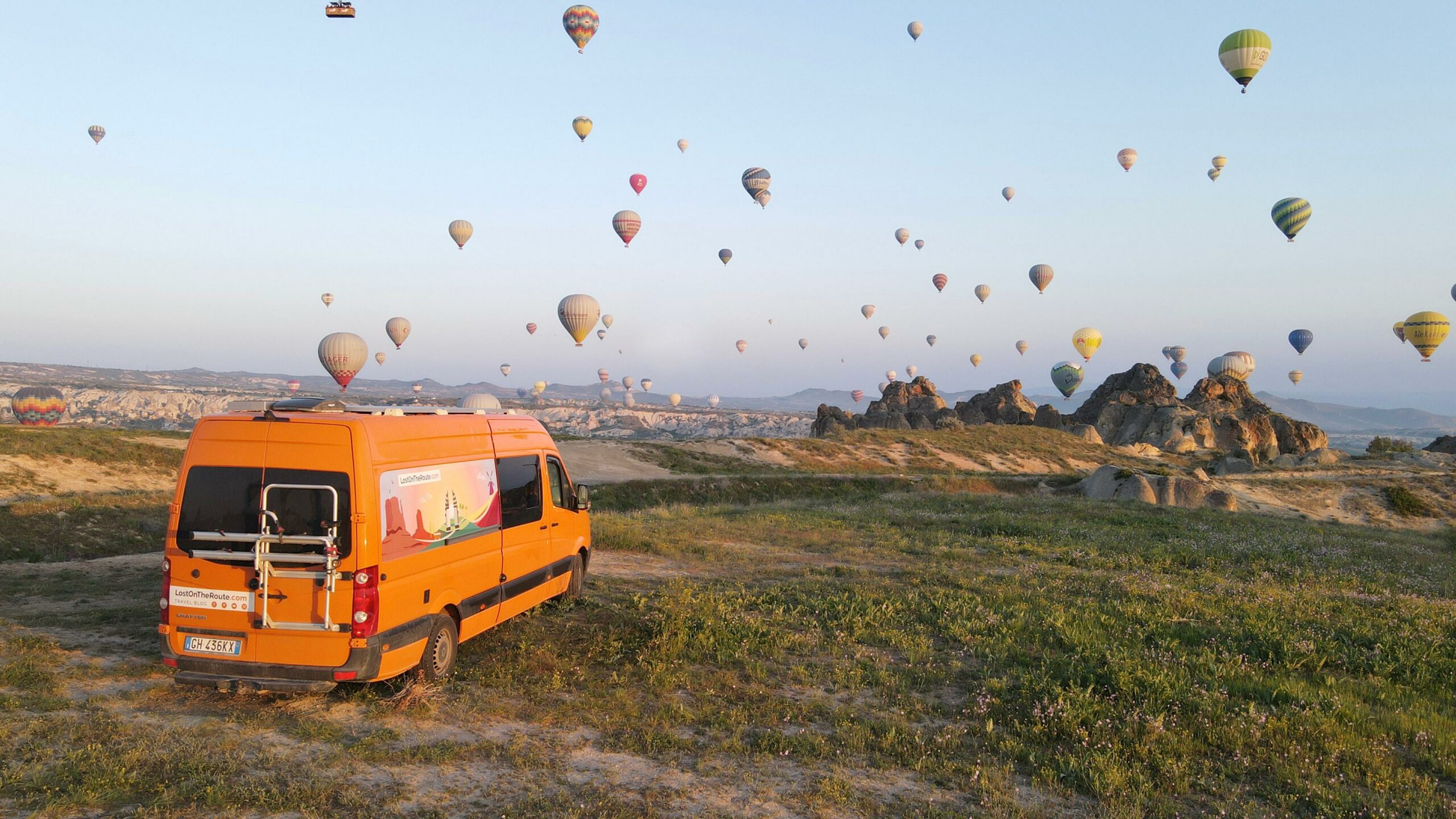 Lost on the Route - Homepage cover for desktop - orange van in cappadocia